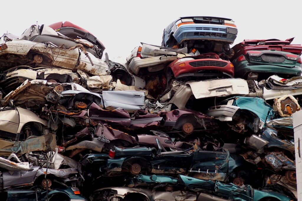 Free photo of a big pile of 500 dollar cash for junk cars in the junkyard.