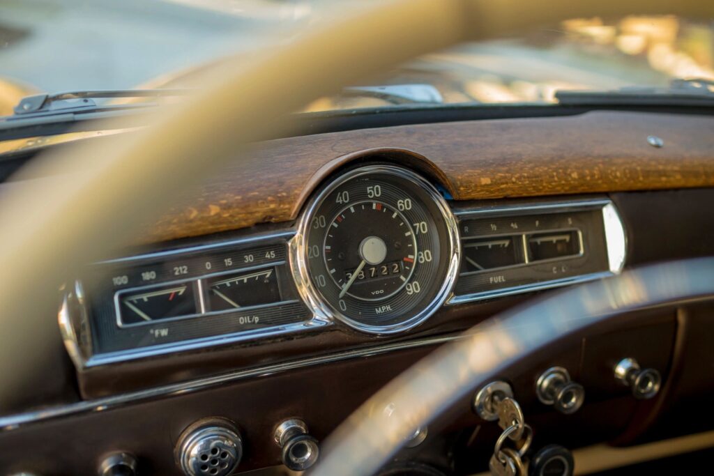 Image of the dashboard of a junked car.